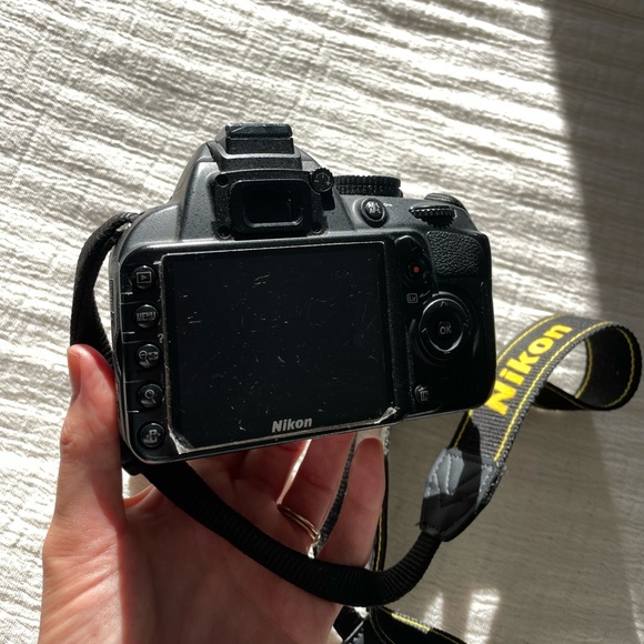 Nikon D3100 with camera bag, charger, lens, and tripod - Picture 5 of 9